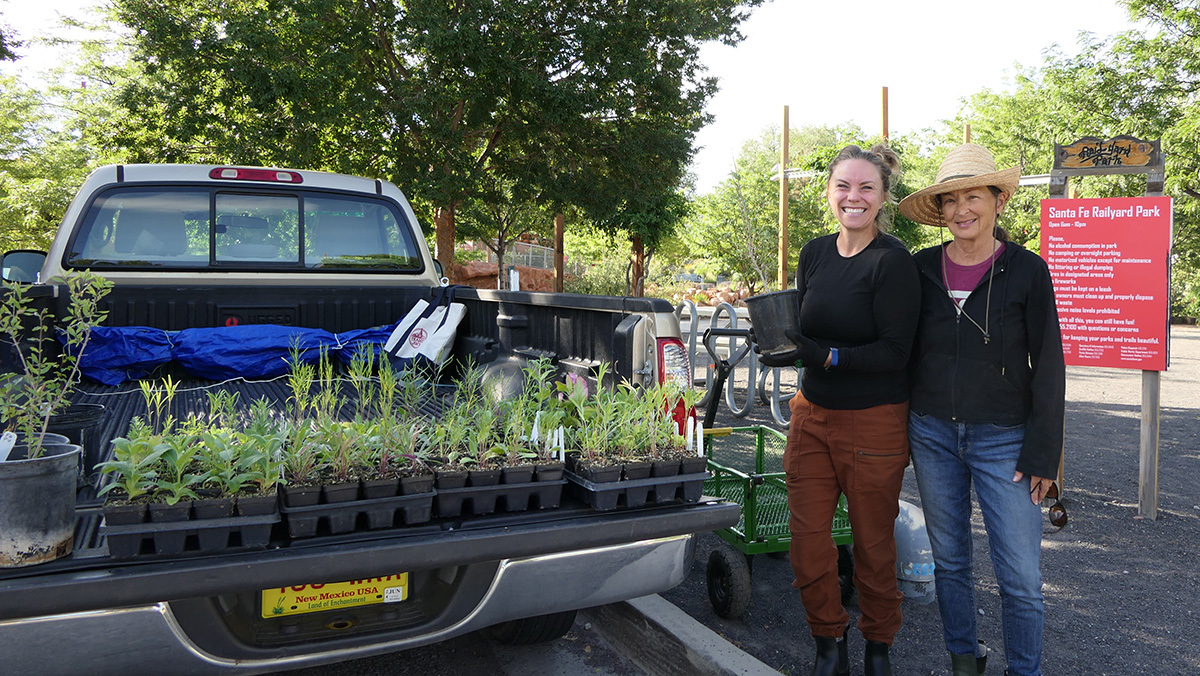 Participants pose with their truckload of new plants